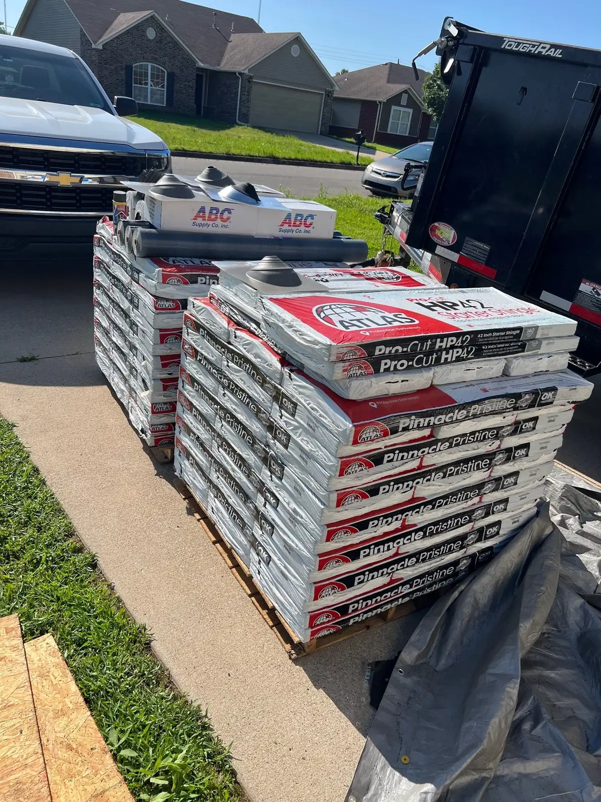 Atlas Pinnacle Pristine shingles and Pro-Cut HP42 starter staged for a FireHouse roof replacement in Broken Arrow