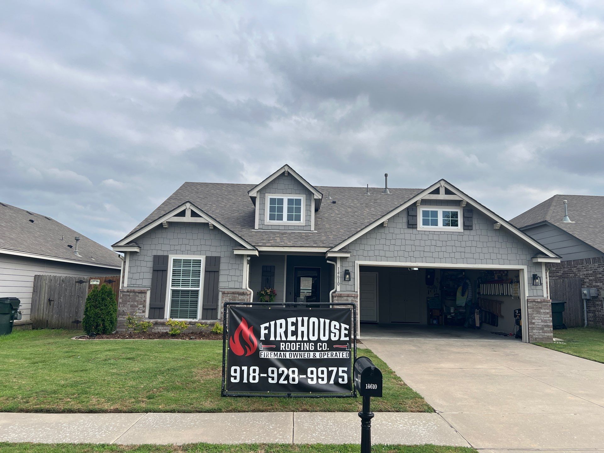 Finished FireHouse Roofing roof on a craftsman home with stone accents in Owasso, Oklahoma