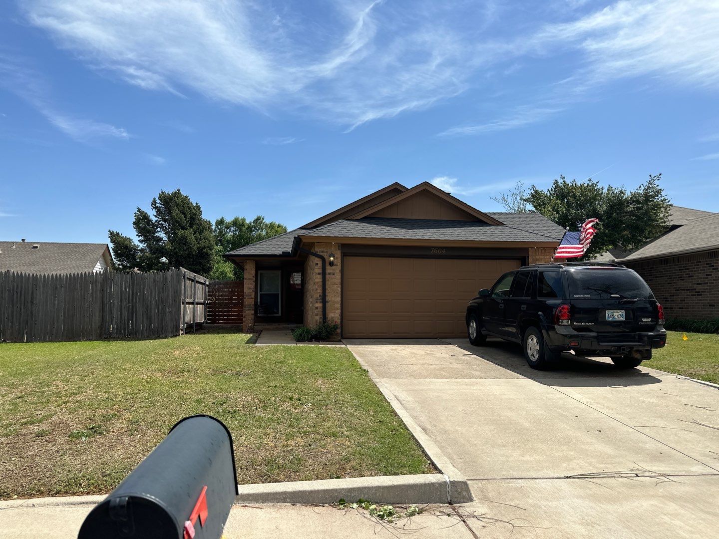 Completed FireHouse Roofing roof replacement on a brick ranch-style home