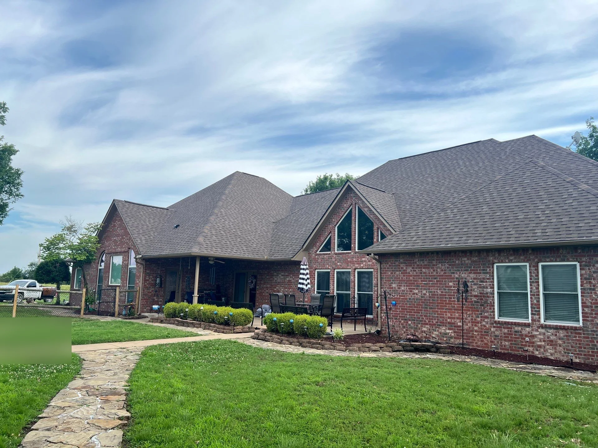 Finished architectural shingle roof on a Claremore brick home