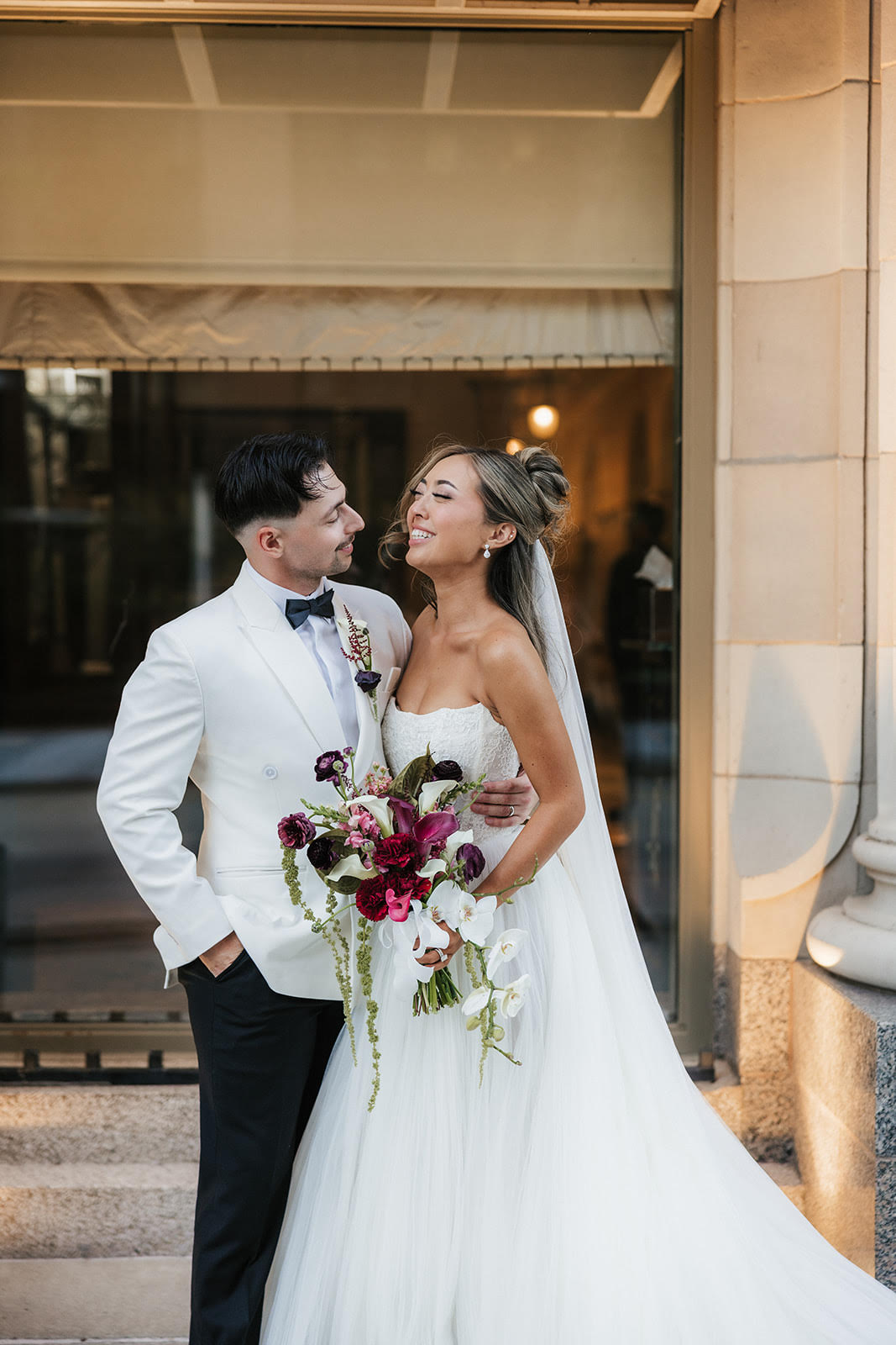 Brayden, General Manager at FireHouse Roofing Co., with his wife Lindsey on their wedding day.