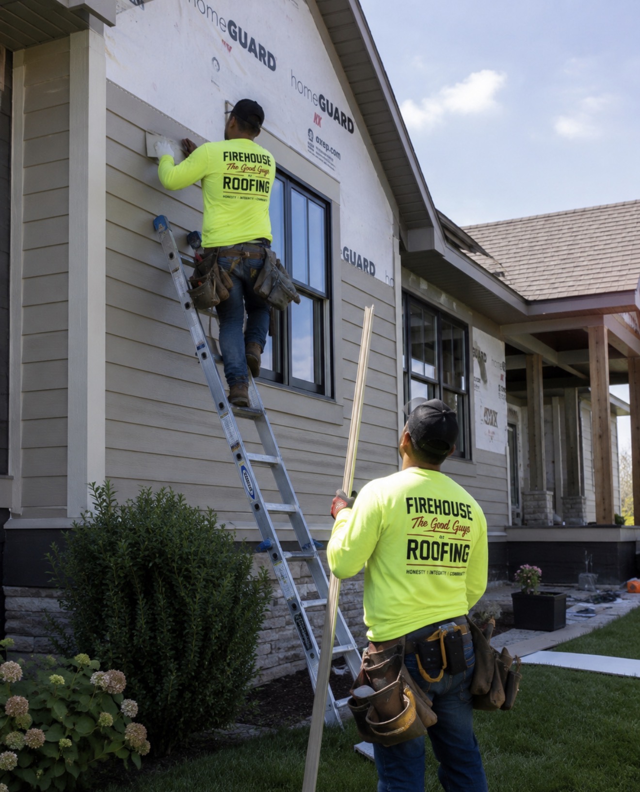Installing lap siding over HomeGuard weather barrier on a single-story home.