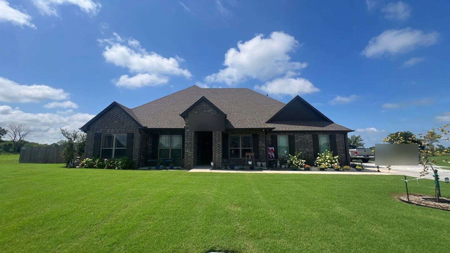 Completed roof replacement on a Coweta brick ranch home