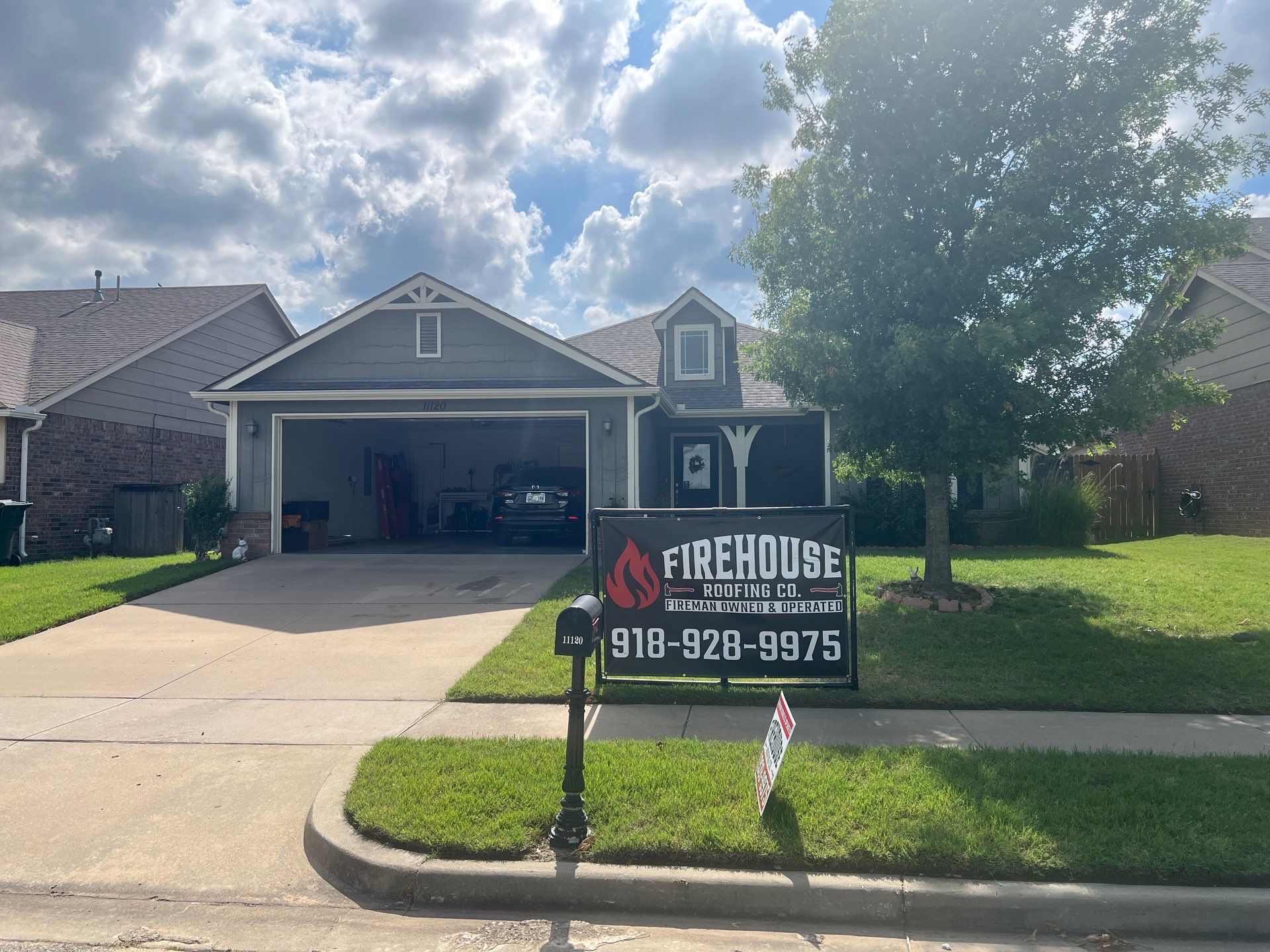 FireHouse Roofing Co. roof replacement on a gray two-story home in Owasso, Oklahoma